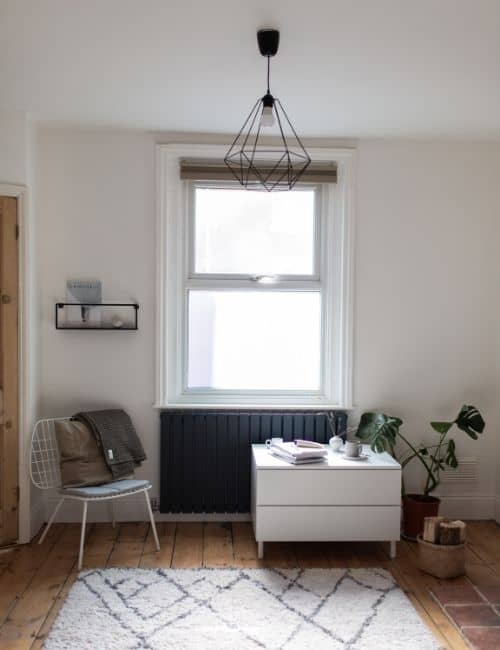 anthracite designer radiator in a minimal living room
