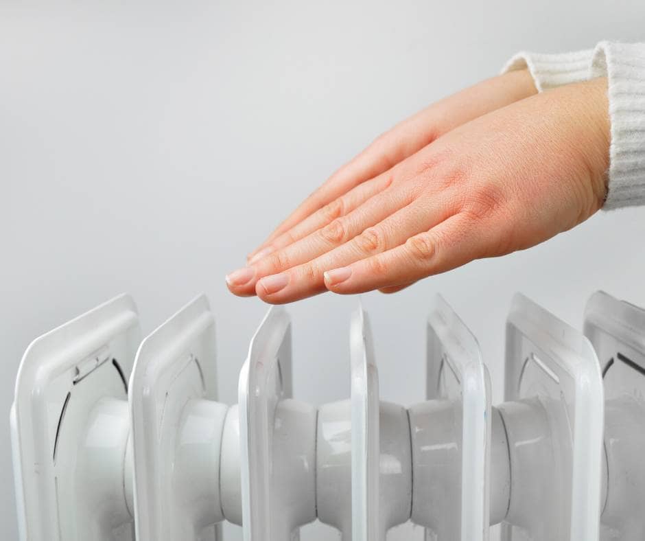 hands on top of a radiator