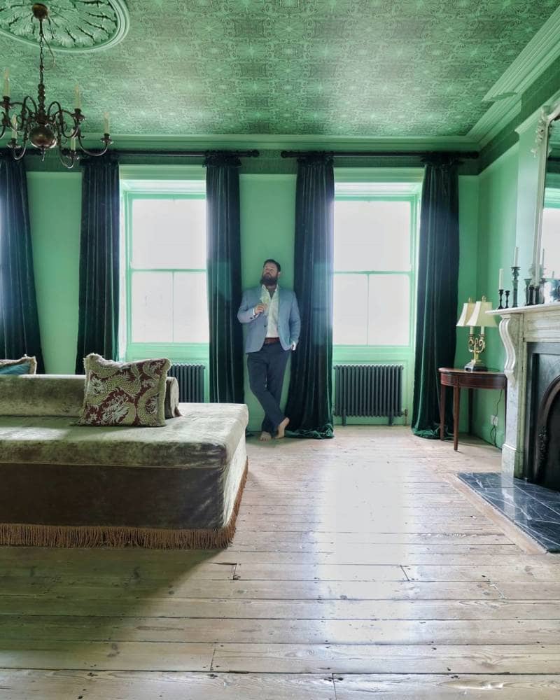 Greg stood in the party room