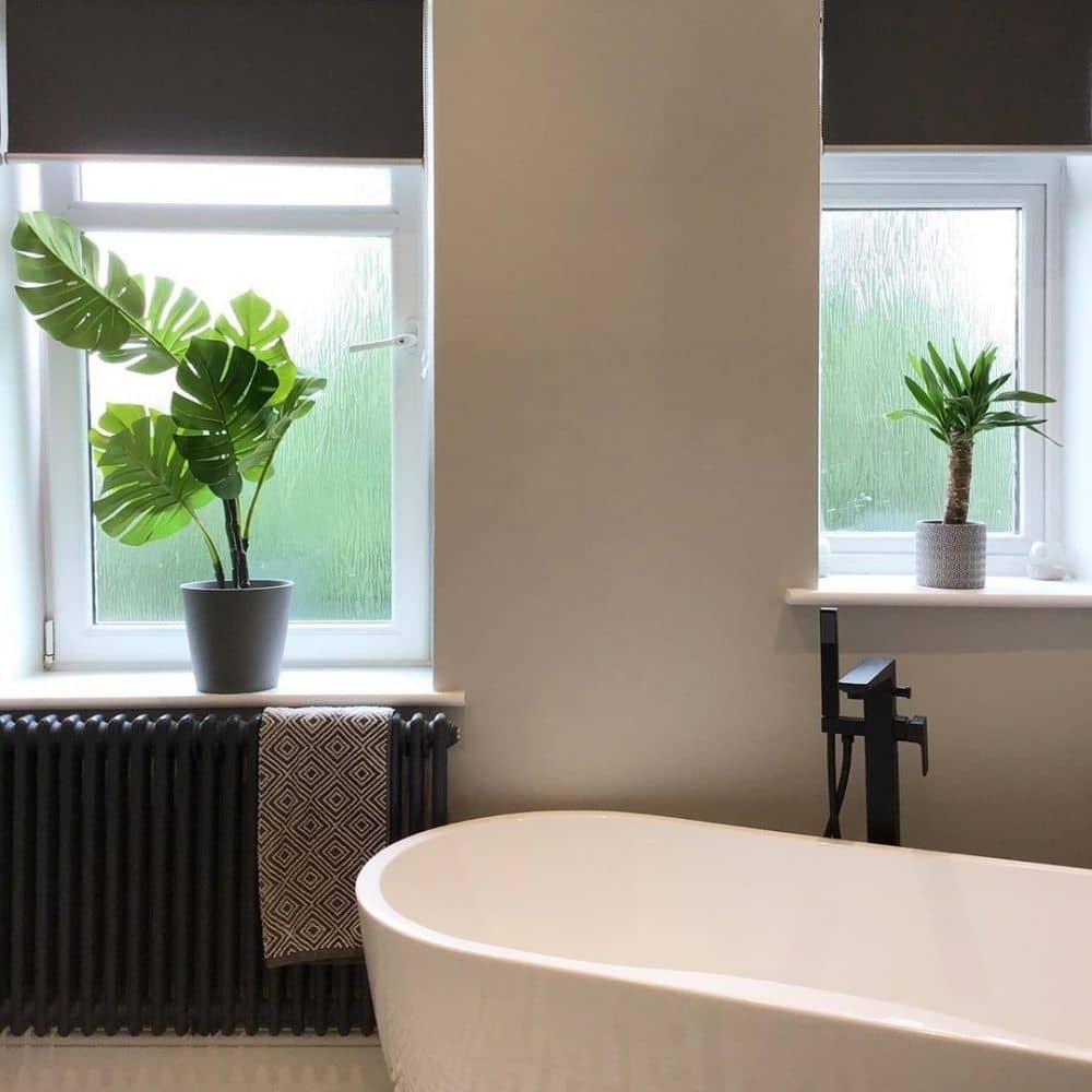 Bathroom anthracite column radiator in a bedroom