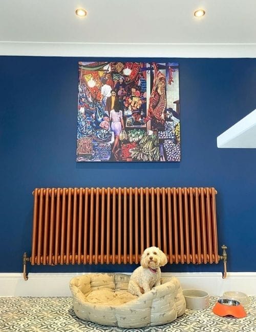 copper radiator on a blue wall