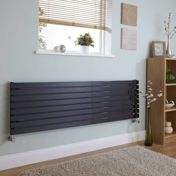 black aruba horizontal designer radiator on green wall