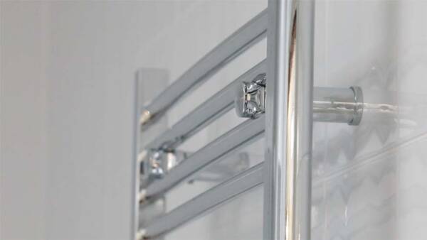 heated towel rail from the side, showing the depth from the wall