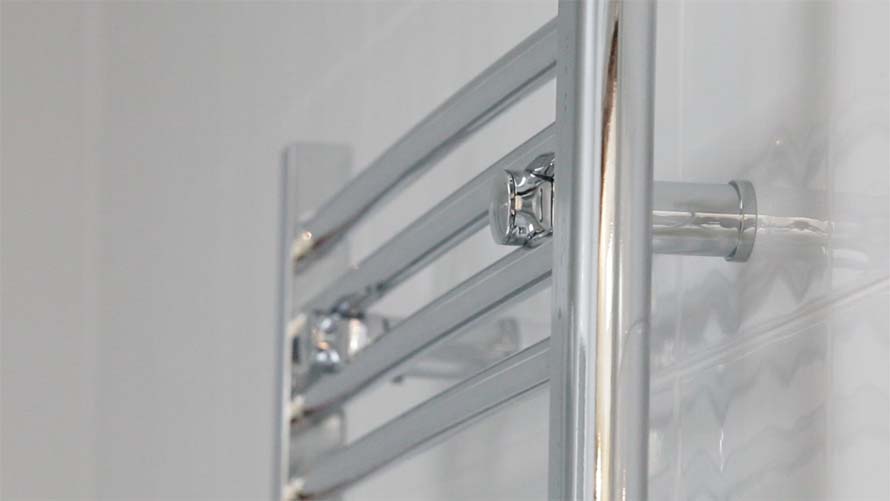 heated towel rail from the side, showing the depth from the wall