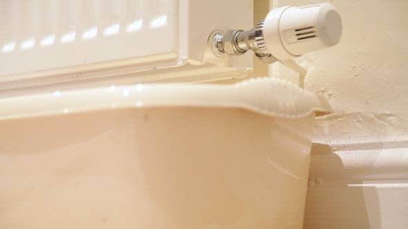water going into a bucket from a radiator