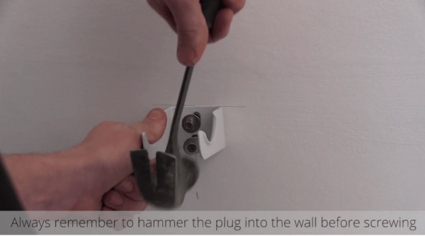 How to Install a Radiator_15_Hammer the Plug into the wall How to Install a Radiator_15_Hammer the Plug into the wall