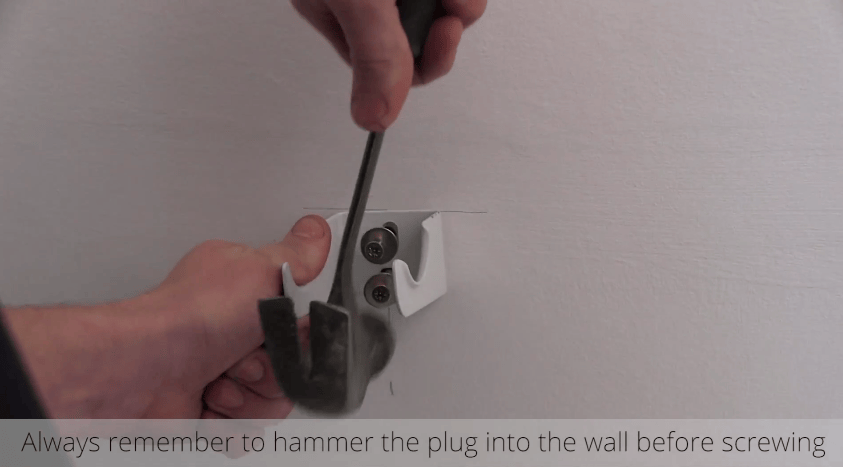 How to Install a Radiator_15_Hammer the Plug into the wall