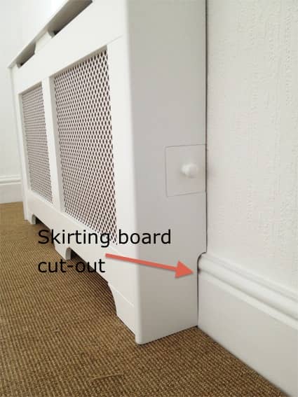 A picture of a radiator cover with a little door for the TRV