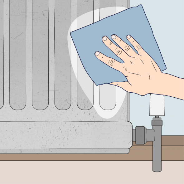 close up of person cleaning a radiator with a cloth
