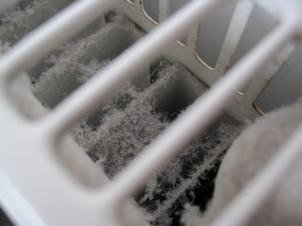 Dust inside the fins of a convector radiator Dust inside the fins of a convector radiator