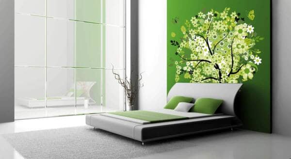 Green wall decal with a tree in a bedroom
