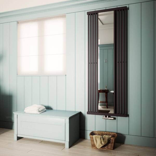 Terma Intra vertical mirrored designer radiator Tall vertical terma intra designer radiator with a mirror on green background