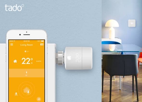 A visual representation of the tado smart app being used with a picture of the tado smart radiator thermostat in the background