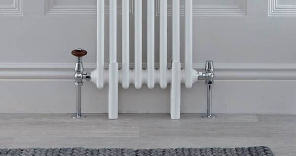 Radiator feet on a white traditional column radiator Radiator feet on a white traditional column radiator