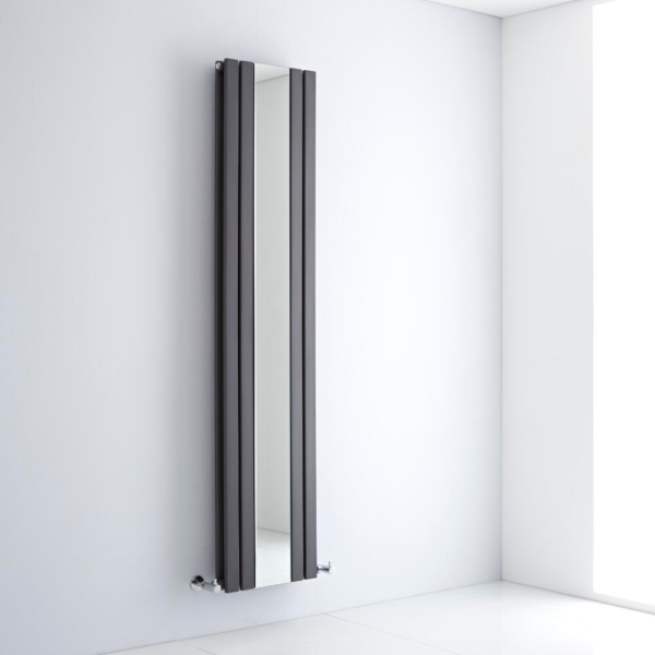 A milano icon vertical designer radiator on a wall in a bathroom