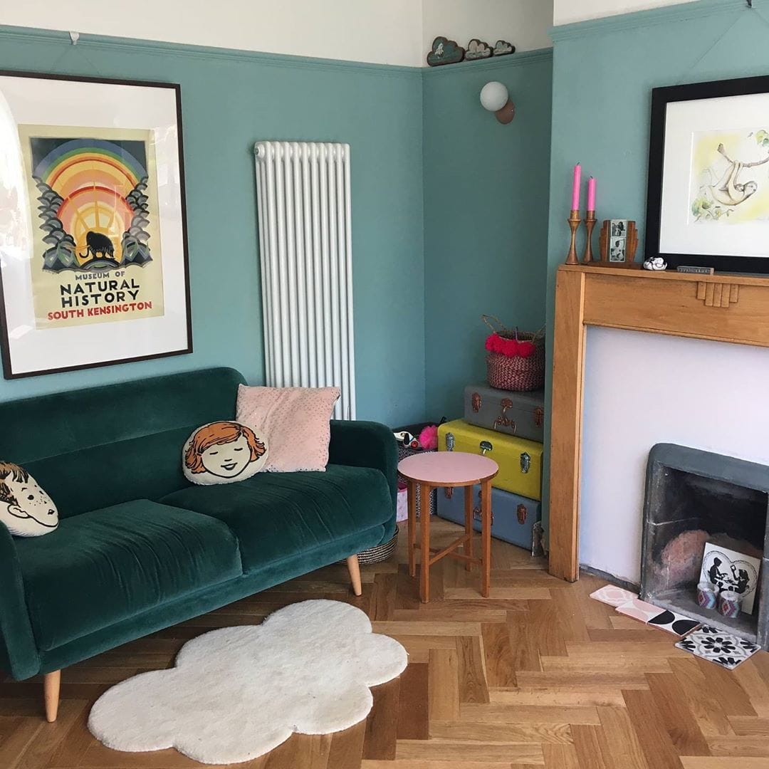 white vertical radiator in a blue living room