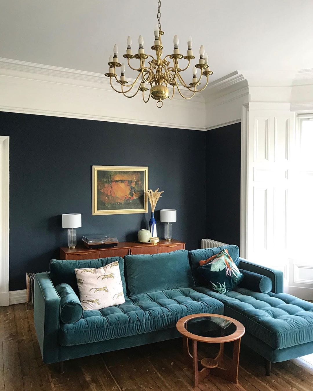 green velvet sofa in a luxury living room