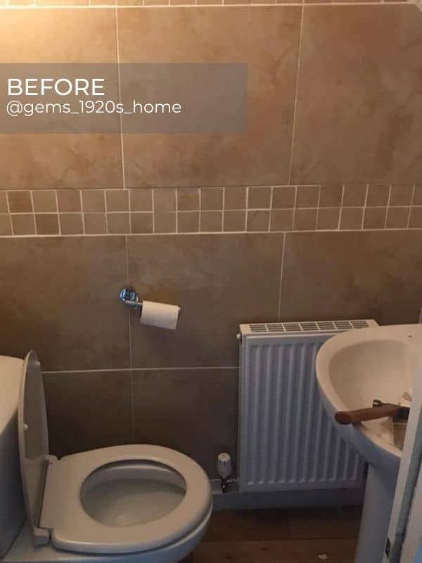 old convector radiator in a beige bathroom before the renovation