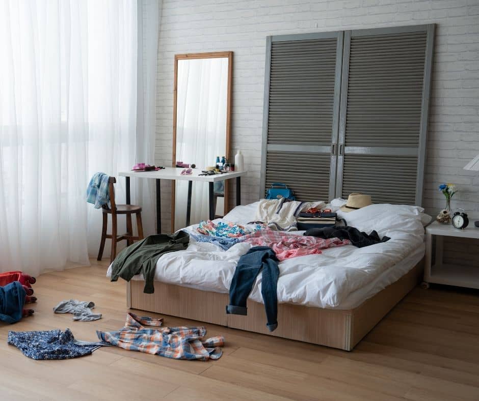 clothes on the floor in a bedroom