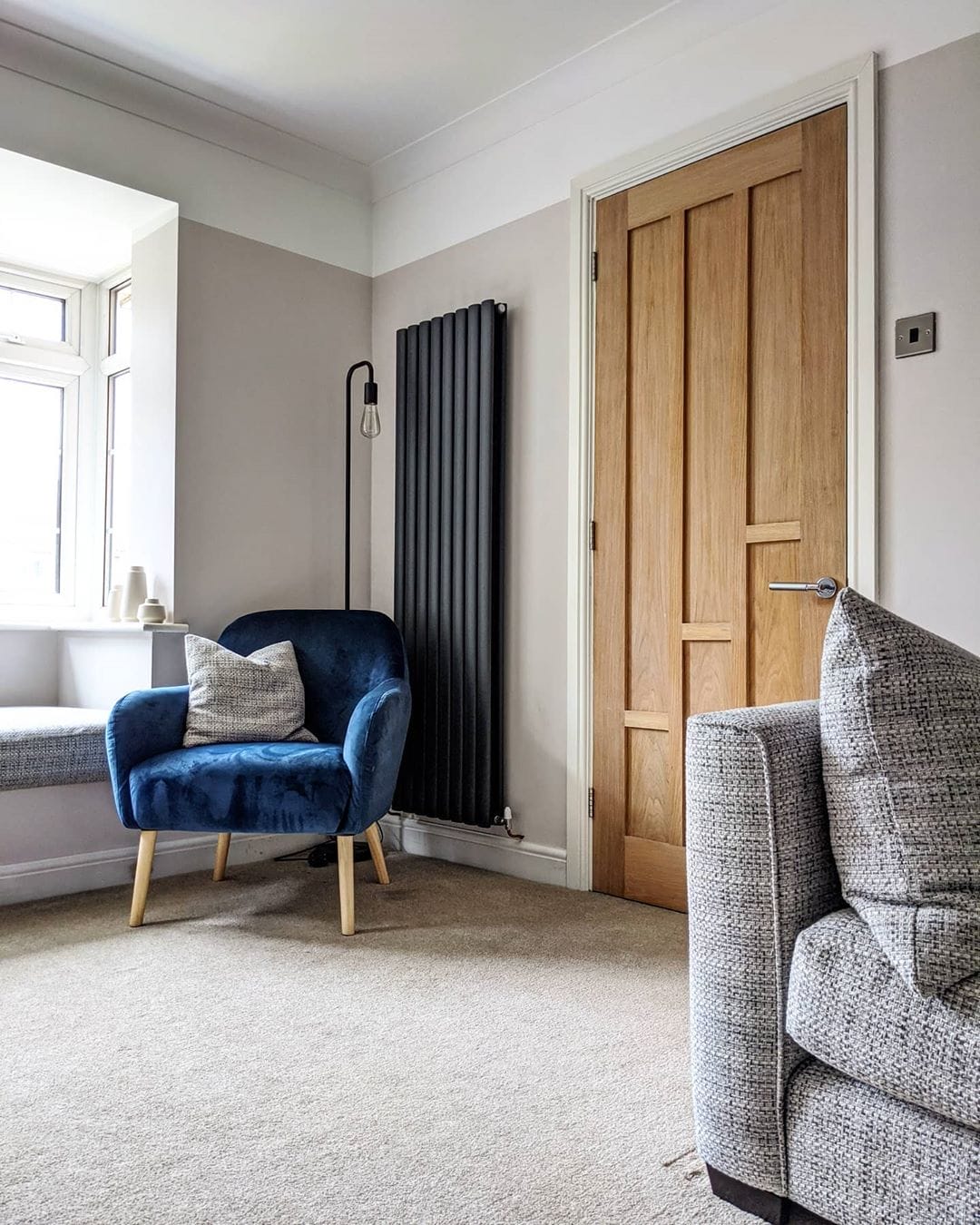 anthracite vertical radiator in a living room