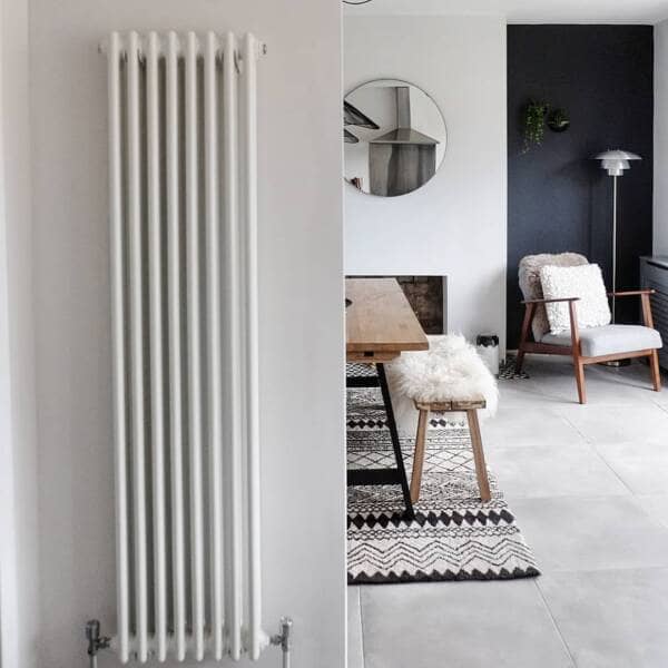 Milano Windsor vertical column radiator in a dining room.