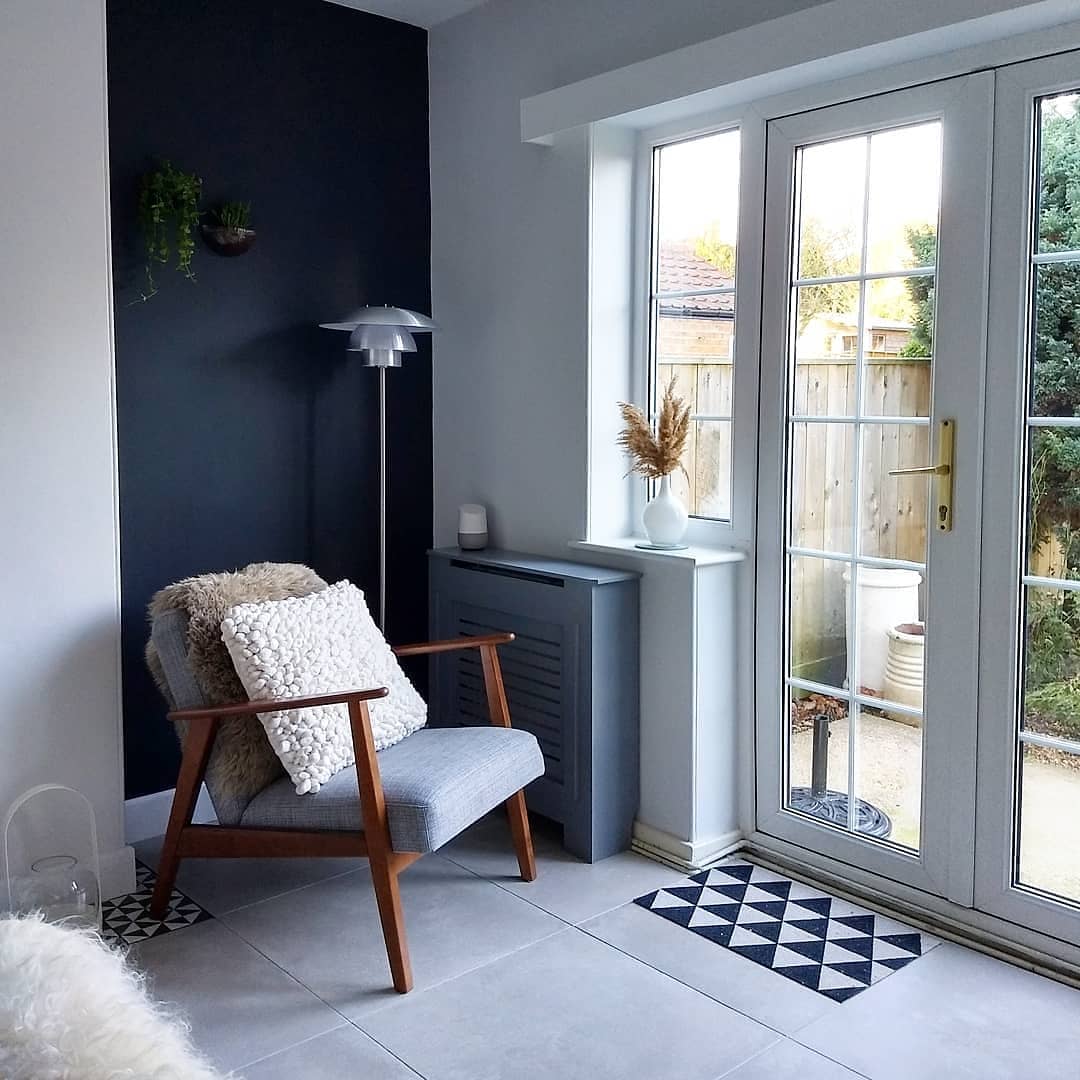 A grey armchair in a Scandinavian style living room.