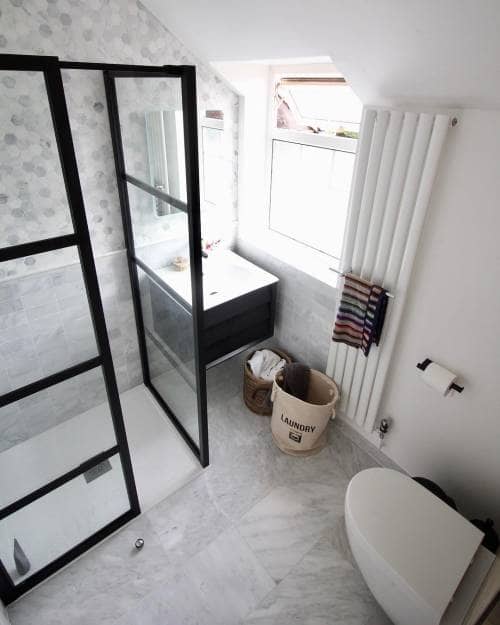 narrow vertical radiator in a small bathroom from above