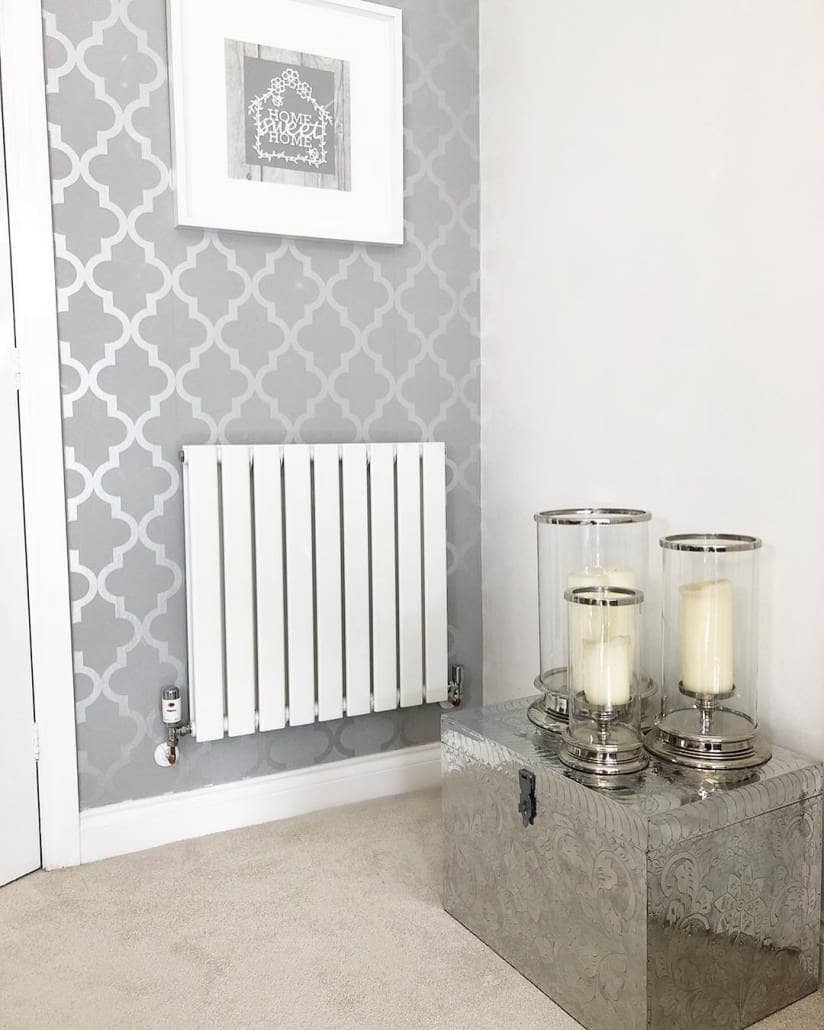 Milano Alpha white vertical radiator with thermostatic valves A white Milano Alpha designer radiator with thermostatic valves.