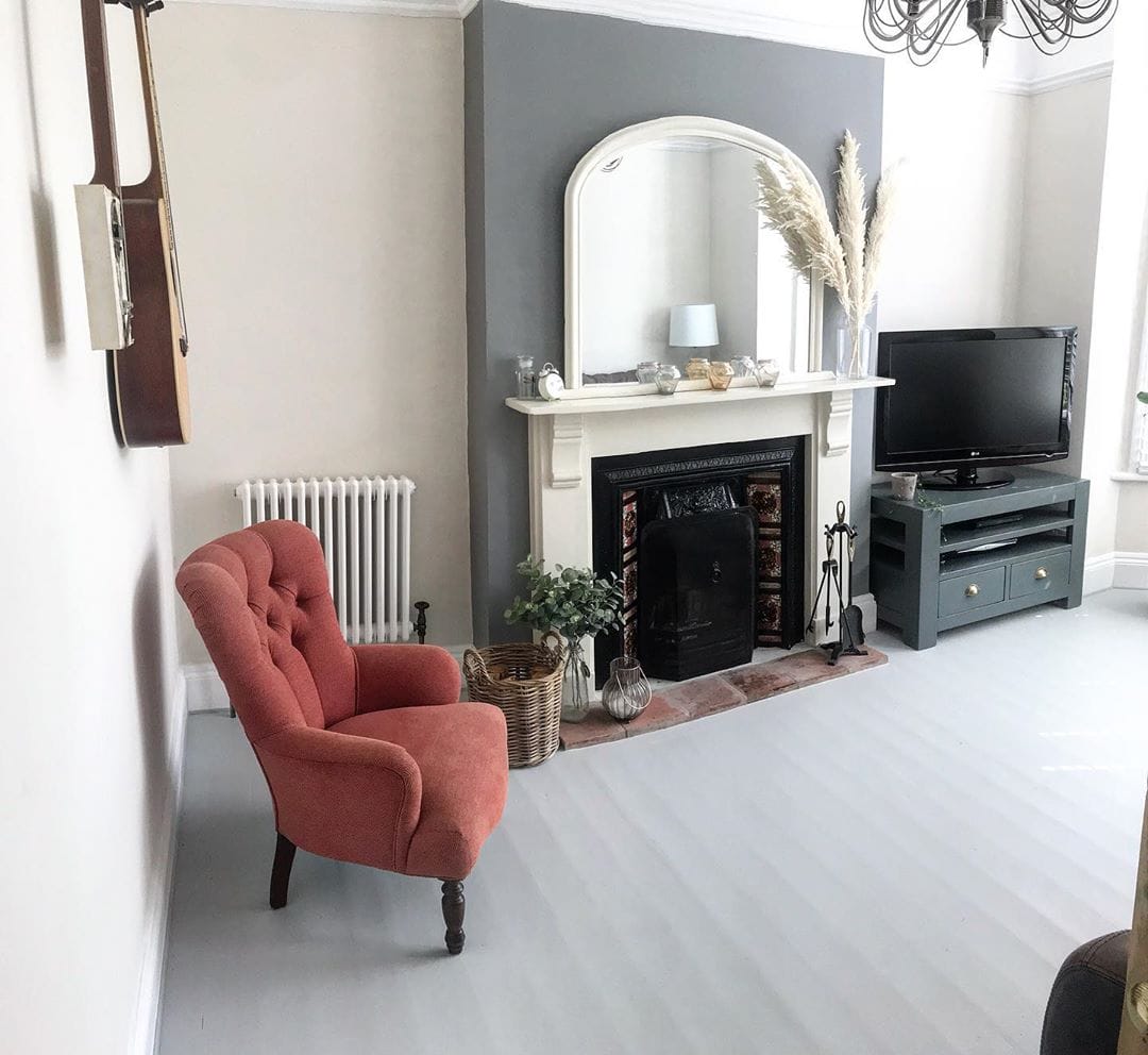 red chair next to a white column radiator