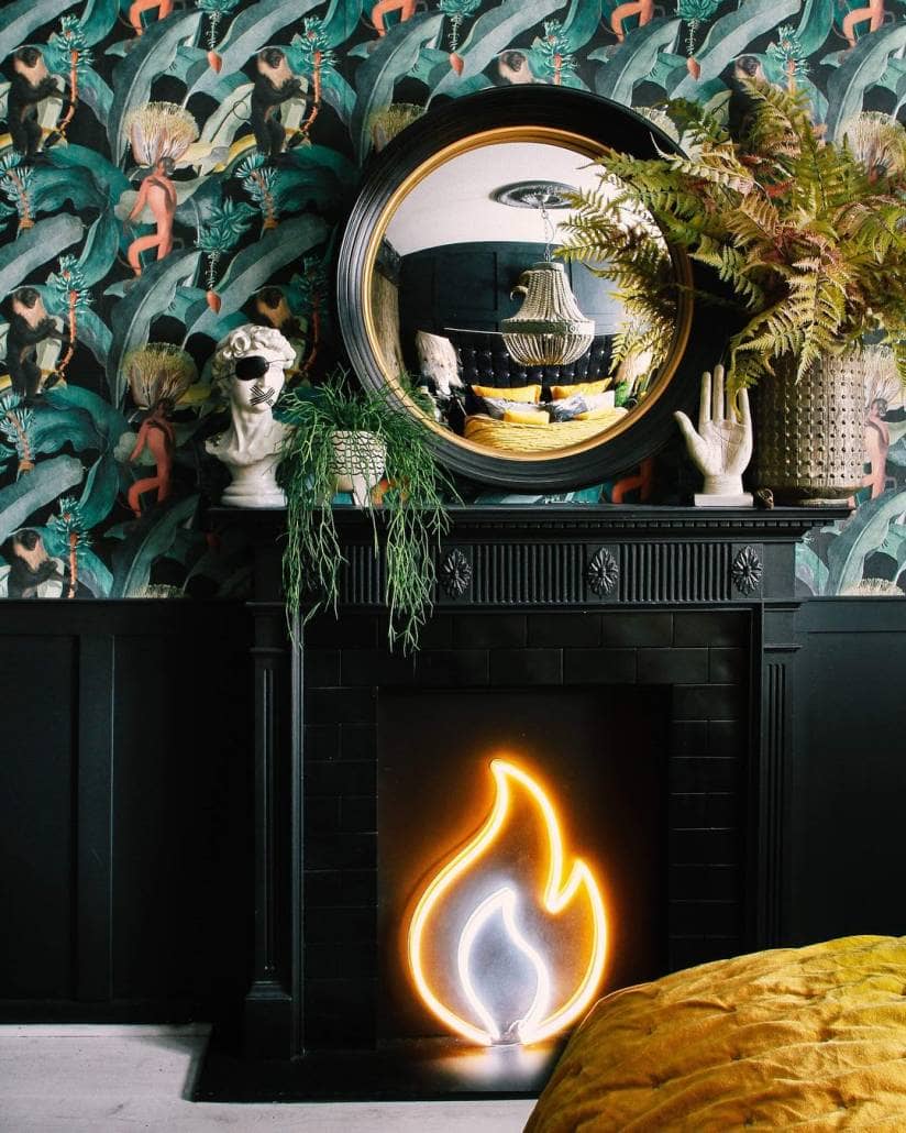 black fireplace with a neon flame