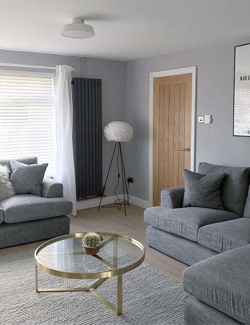anthracite vertical radiator in a grey living room