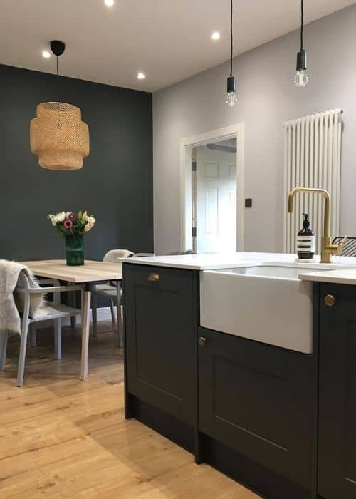 white vertical column radiator in a kitchen