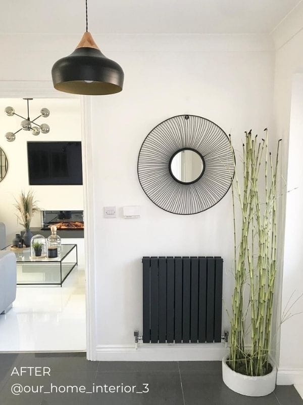 anthracite horizontal designer radiator on white wall in a hallway