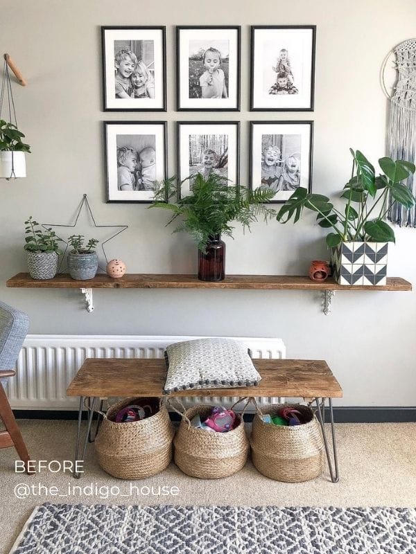 white horizontal convector radiator under busy shelf a standard white radiator under a shelf blocked by table