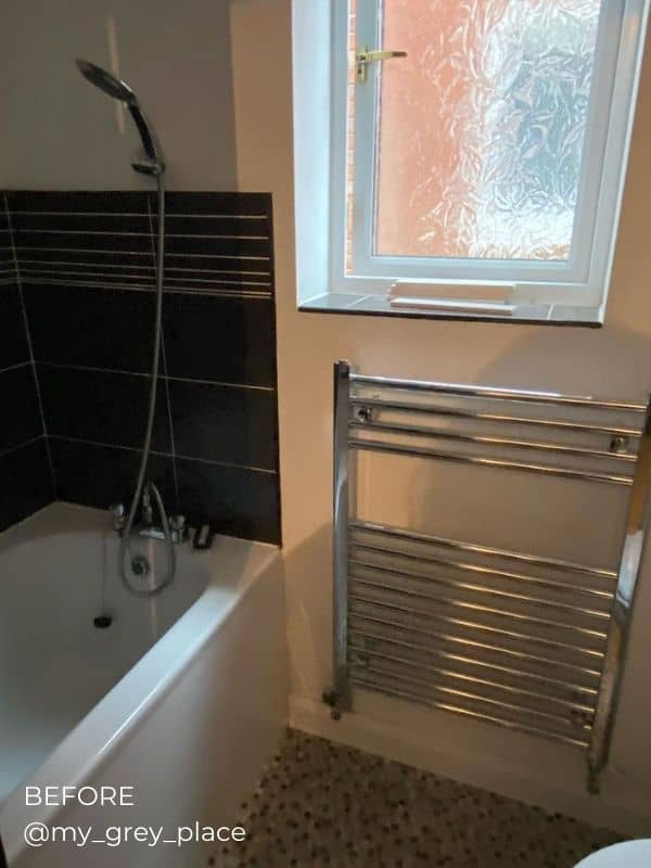heated towel rail in a bathroom before the renovation