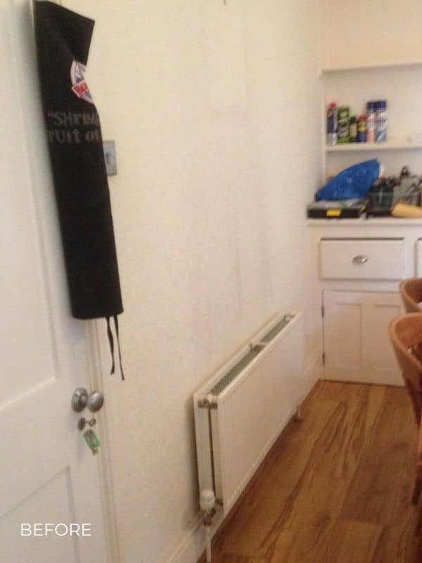 a horizontal radiator in a kitchen before he renovation