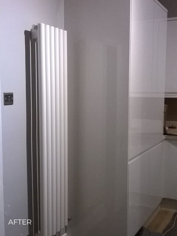 vertical designer radiator in a kitchen