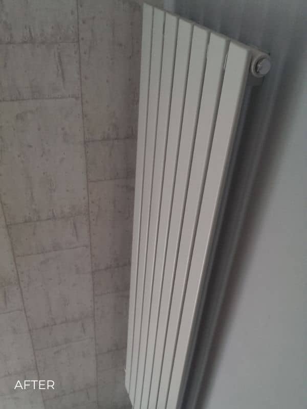 vertical designer radiator in a hallway