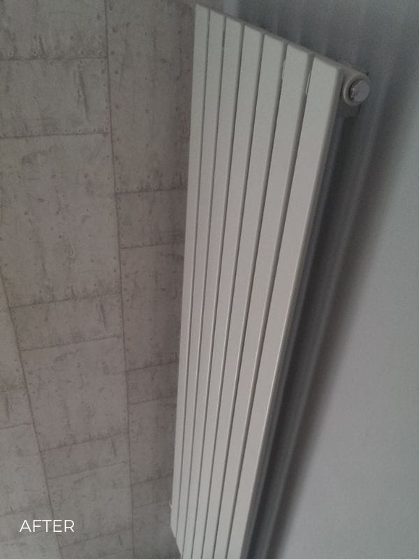 vertical designer radiator in a hallway white vertical designer radiator in a hallway