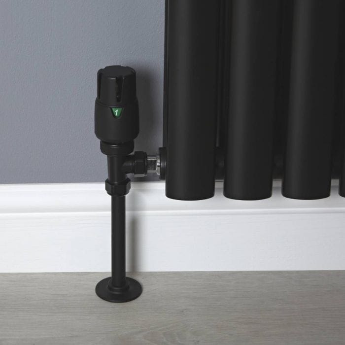 Black thermostatic radiator valve A black thermostatic radiator valve set to position 1