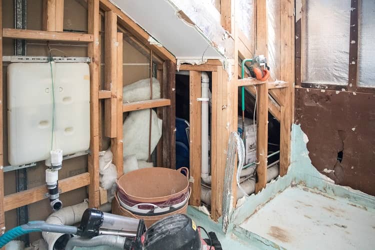 a bathroom stripped bare of all fixtures and fittings - a DIY renovations nightmare