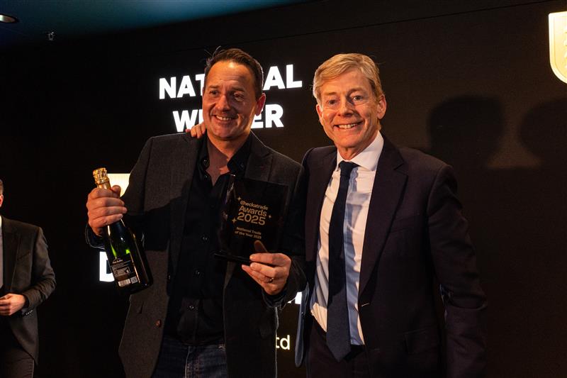 DeanStaniland accepting his award from Checkatrade founder Richard Harpin