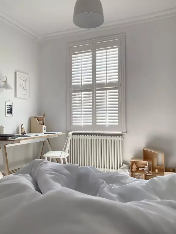 Donna Howell house tour - white bedroom with white radiator