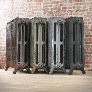 four cast iron radiators beside each other in a row