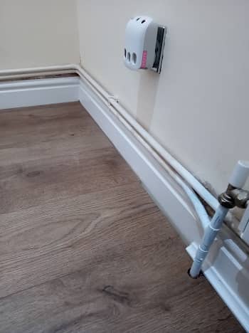 Covering Radiator Pipes A Bestheating, How To Cut Skirting Board Around Radiator Pipes Floor