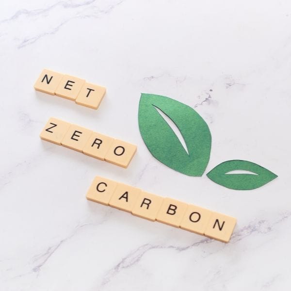 net zero carbon spelled out on scrabble tiles
