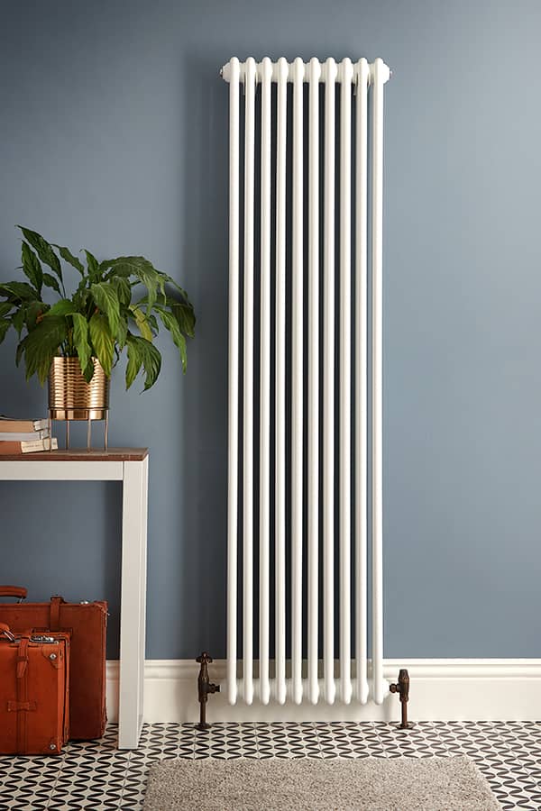 a tall white milano windsor radiator on a blue background