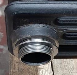 a close up of the joinign section of a cast iron radiator