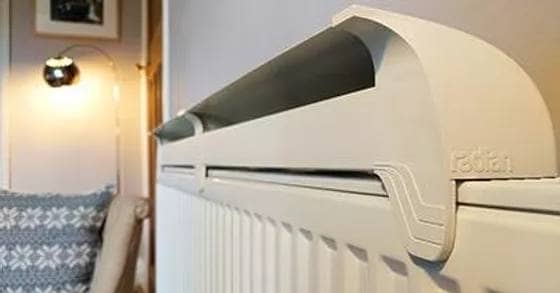 a radfan medium 3 heater on top of a radiator to improve efficiency and performance 
