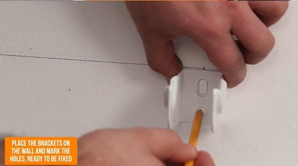 hand marking a radiator hole